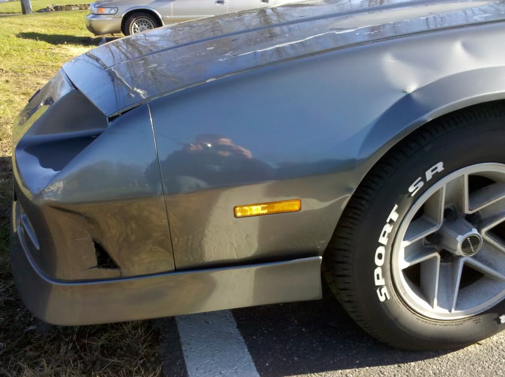 A 1985 Pontiac Fiero econo-commuter in a Northern California wrecking yard.